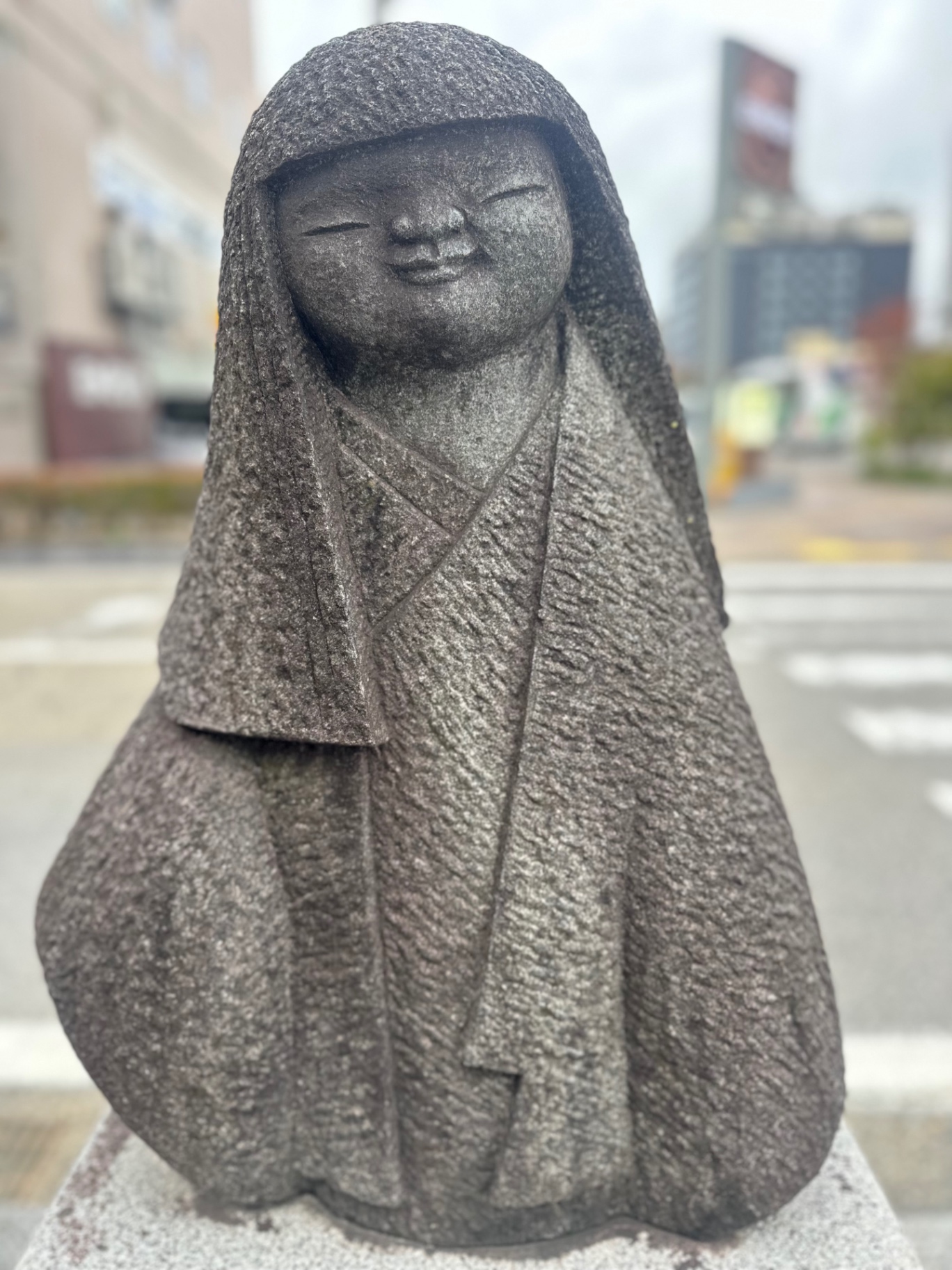 Jizo stone statue in quiet devotion