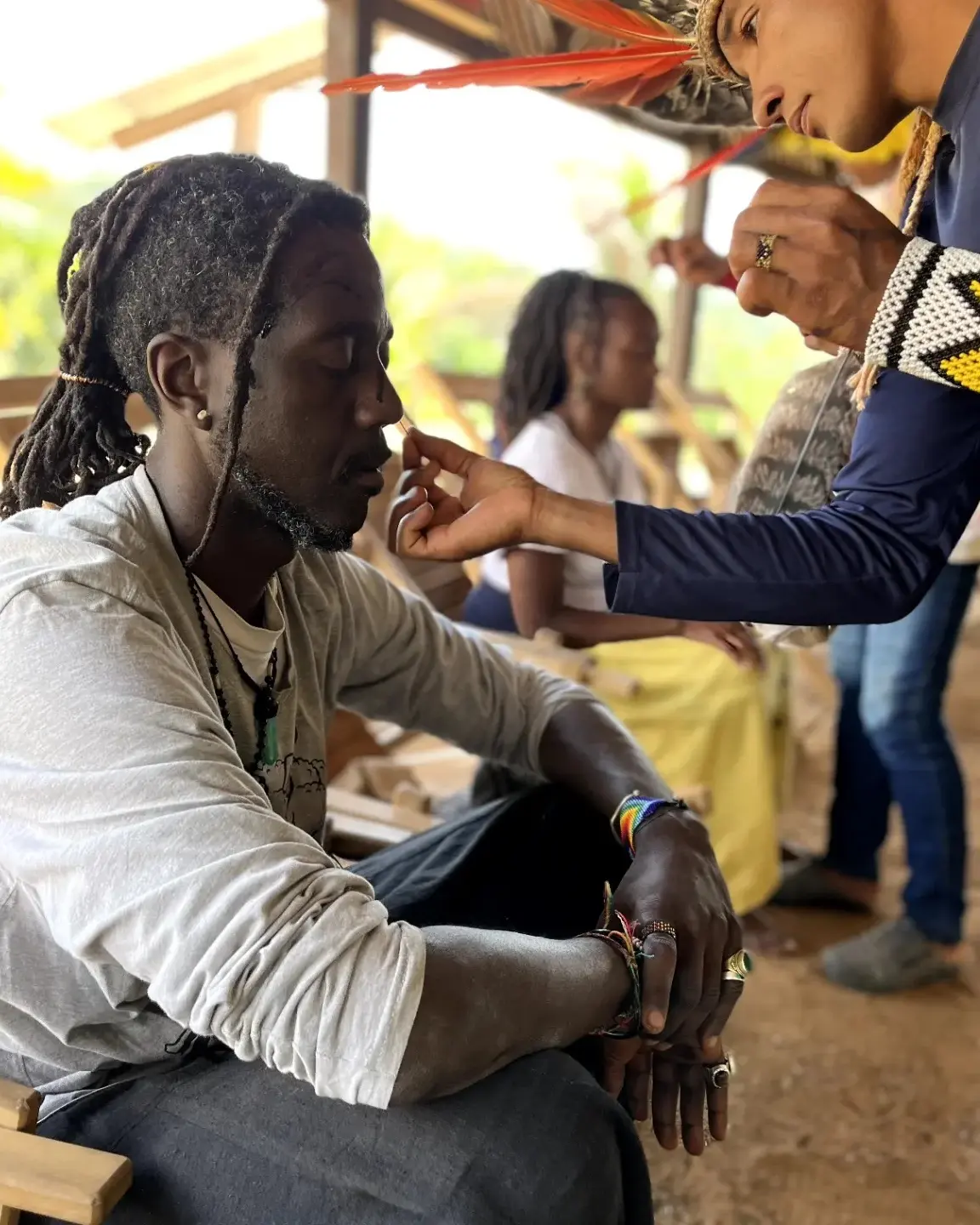 A ceremony in the Amazon with face paint and ancestral regalia